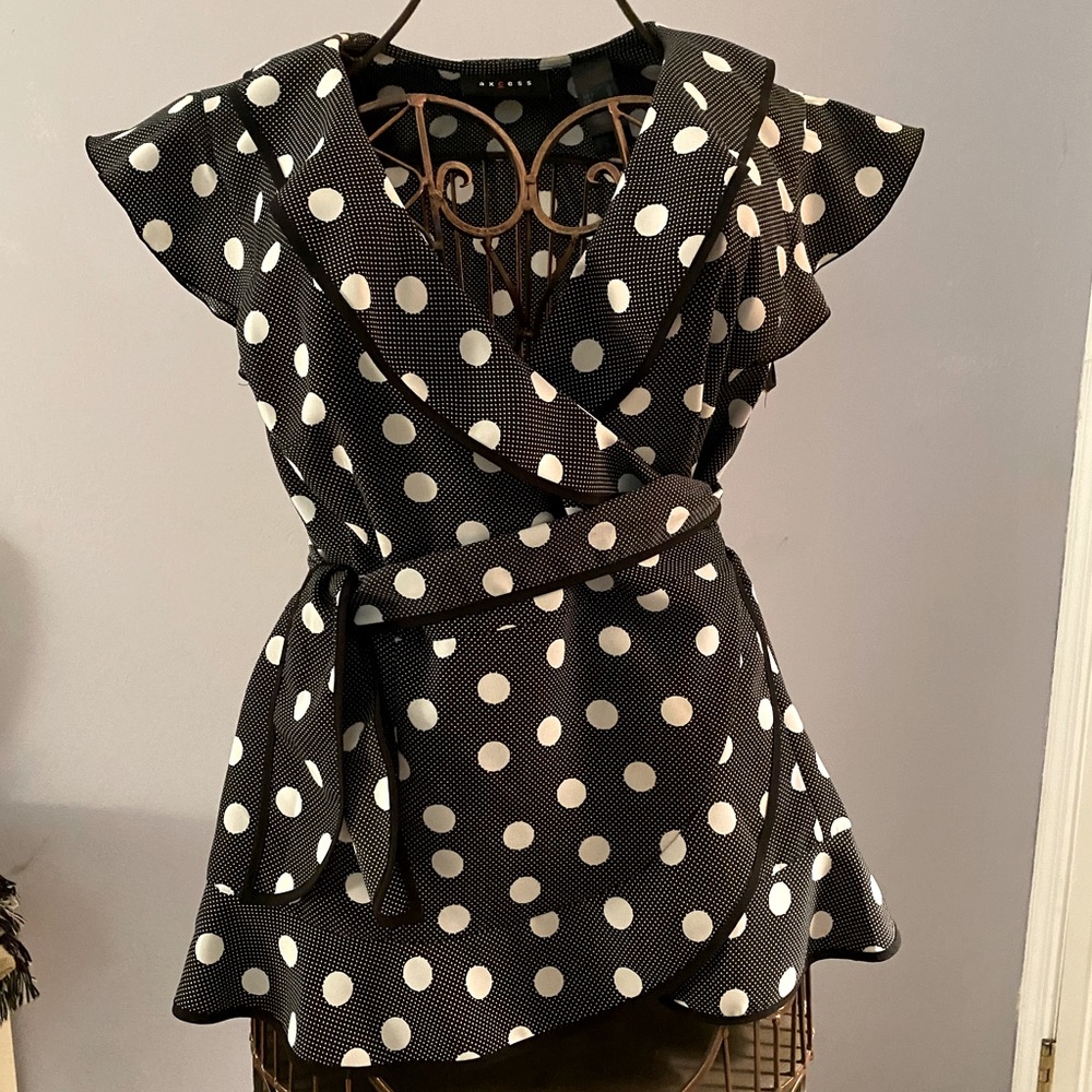 Black and white polka dot ruffled crossbody blouse
